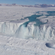 An enormous waterfall at the Nansen Ice Shelf channels summertime meltwater into the ocean, a process that seemingly protects the shelf from collapse. Image courtesy of Jonathan Kingslake